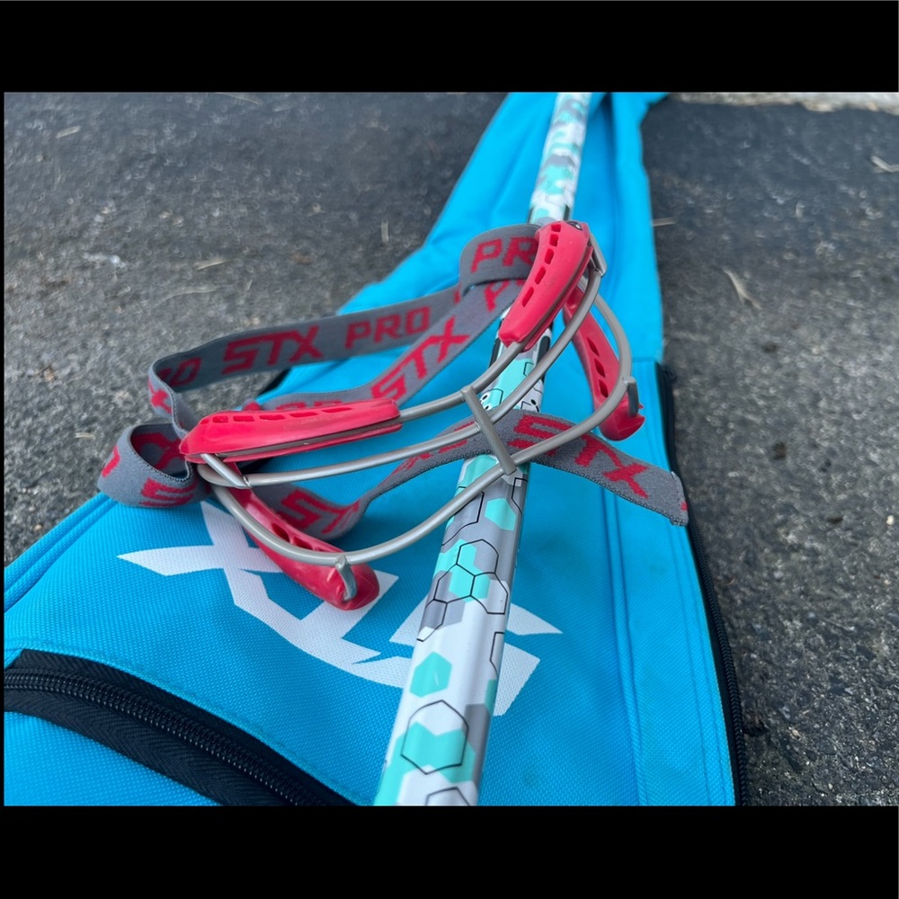 Women’s lacrosse stick with bag and goggles
